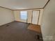 Spacious living room with carpet and entryway at 169 Adams Cir, Candor, NC 27229