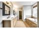 Elegant bathroom with double sinks, a soaking tub, and custom cabinetry at 1765 Old Clay Hill Rd, York, SC 29745