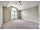 Carpeted bedroom with an arched window and a vaulted ceiling at 1765 Old Clay Hill Rd, York, SC 29745