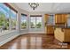 Bright breakfast nook with hardwood floors, bay windows with lake view, and adjoining kitchen at 1765 Old Clay Hill Rd, York, SC 29745