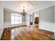 Bright dining room boasts hardwood floors, chandelier, and a large window for ample natural light at 1765 Old Clay Hill Rd, York, SC 29745