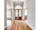 View of the grand foyer with rich hardwood floors and large decorative front doors at 1765 Old Clay Hill Rd, York, SC 29745