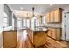 Spacious kitchen featuring hardwood floors, center island with granite countertops, and ample cabinet space at 1765 Old Clay Hill Rd, York, SC 29745