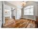 Another view of the spacious home office featuring hardwood floors and a chandelier at 1765 Old Clay Hill Rd, York, SC 29745