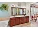 Bathroom featuring double sinks, granite countertops, and walk-in access at 2001 Arbor Hills Dr, Indian Trail, NC 28079