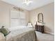 Comfortable bedroom with a ceiling fan and shutters at 2001 Arbor Hills Dr, Indian Trail, NC 28079