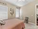 Inviting bedroom with a shuttered window and a ceiling fan at 2001 Arbor Hills Dr, Indian Trail, NC 28079