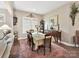 A well-appointed dining area featuring dark hardwood floors and decor elements at 2001 Arbor Hills Dr, Indian Trail, NC 28079