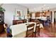 Formal dining room with hardwood floors, traditional furniture, and view to kitchen at 2001 Arbor Hills Dr, Indian Trail, NC 28079