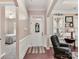 Elegant foyer with hardwood floors, wainscoting, and a view into the bedroom and formal sitting room at 2001 Arbor Hills Dr, Indian Trail, NC 28079