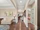 Spacious hallway with hardwood floors, leading to the kitchen and bedroom at 2001 Arbor Hills Dr, Indian Trail, NC 28079