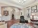 Comfortable living room with natural light, hardwood floors, and classic decor at 2001 Arbor Hills Dr, Indian Trail, NC 28079