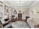 Bright formal living room featuring hardwood floors, a tray ceiling, and elegant décor at 2001 Arbor Hills Dr, Indian Trail, NC 28079