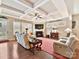 A bright living room with a fireplace and hardwood flooring under a coffered ceiling at 2001 Arbor Hills Dr, Indian Trail, NC 28079