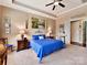 Spacious main bedroom with a ceiling fan and tray ceiling at 2001 Arbor Hills Dr, Indian Trail, NC 28079