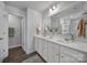 Elegant bathroom with double sinks, a large mirror, and a shower at 215 Briana Marie Way, Indian Trail, NC 28079