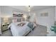 Well-lit bedroom with a comfortable king-size bed and an ensuite bathroom at 215 Briana Marie Way, Indian Trail, NC 28079