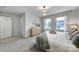 Bright bedroom with a queen-size bed and natural light at 215 Briana Marie Way, Indian Trail, NC 28079