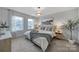 Bright bedroom featuring a king-size bed and calming decor at 215 Briana Marie Way, Indian Trail, NC 28079