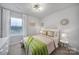 Charming bedroom with a queen-size bed and bright window at 215 Briana Marie Way, Indian Trail, NC 28079