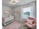 Charming Bedroom with a crib, rocker, and soft color palette at 215 Briana Marie Way, Indian Trail, NC 28079