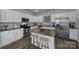 Spacious kitchen featuring an island and stainless steel appliances at 215 Briana Marie Way, Indian Trail, NC 28079