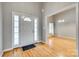 Home foyer featuring hardwood floors, a white front door, and an open view into dining room at 2288 S Paraham Rd, York, SC 29745