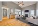 Open-concept living room with fireplace, hardwood floors, and lots of natural light at 2288 S Paraham Rd, York, SC 29745