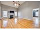 Living room featuring a fireplace, hardwood floors, and ample natural light at 2288 S Paraham Rd, York, SC 29745