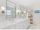 Bright bathroom featuring dual vanity sinks with marble countertops and modern fixtures at 2315 Red Fox Trl, Charlotte, NC 28211