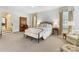 Comfortable bedroom with bright windows, neutral tones, and traditional furnishings at 2315 Red Fox Trl, Charlotte, NC 28211