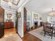 Dining area with hardwood floors, chandelier, fireplace and a collection of antique furniture at 2315 Red Fox Trl, Charlotte, NC 28211