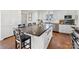 Spacious kitchen island offers barstool seating, plentiful counter space, and modern appliances at 2315 Red Fox Trl, Charlotte, NC 28211