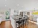 Bright kitchen with stainless steel appliances, dark countertops, and kitchen island at 2315 Red Fox Trl, Charlotte, NC 28211