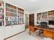 Home office featuring custom built-in bookshelves and desk at 2315 Red Fox Trl, Charlotte, NC 28211