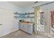 Basement kitchenette with granite countertop and shelves at 2410 Hopecrest Dr, Charlotte, NC 28210