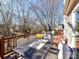 Deck with table, chairs, and flowers, providing a relaxing outdoor space at 2410 Hopecrest Dr, Charlotte, NC 28210