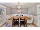 Dining room with a wood table, neutral walls, and chandelier at 2410 Hopecrest Dr, Charlotte, NC 28210