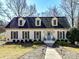 Ranch style brick house with gray shutters and walkway at 2410 Hopecrest Dr, Charlotte, NC 28210