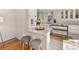 Kitchen breakfast bar with white quartz countertop and two gray stools at 2410 Hopecrest Dr, Charlotte, NC 28210