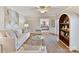 Spacious living room with a neutral color palette and built-in shelving at 2410 Hopecrest Dr, Charlotte, NC 28210