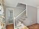 Elegant staircase with a white railing leading to the upper level at 2410 Hopecrest Dr, Charlotte, NC 28210