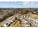 Neighborhood aerial view featuring well-maintained homes, mature trees, and a serene suburban setting at 2943 Village Center Dr, Dallas, NC 28034