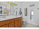 Bright bathroom featuring a double vanity, toilet, and decorative touches for a comfortable feel at 2943 Village Center Dr, Dallas, NC 28034