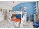 Fun bedroom with blue walls, gaming decor, bunkbeds with a slide, and lots of natural light at 2943 Village Center Dr, Dallas, NC 28034