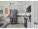 Modern kitchen features stainless steel refrigerator, ample cabinet space, and cozy breakfast nook at 2943 Village Center Dr, Dallas, NC 28034