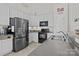 Charming kitchen with stainless steel refrigerator and modern appliances, ample storage at 2943 Village Center Dr, Dallas, NC 28034