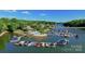 Aerial view of community marina and pool house with boat slips, docks, and waterfront homes at 296 Windemere Isle Rd, Statesville, NC 28677