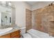 Bathroom features a tiled shower/tub and granite vanity top at 296 Windemere Isle Rd, Statesville, NC 28677