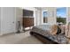 Comfortable bedroom featuring large windows and a TV atop a wooden dresser at 296 Windemere Isle Rd, Statesville, NC 28677